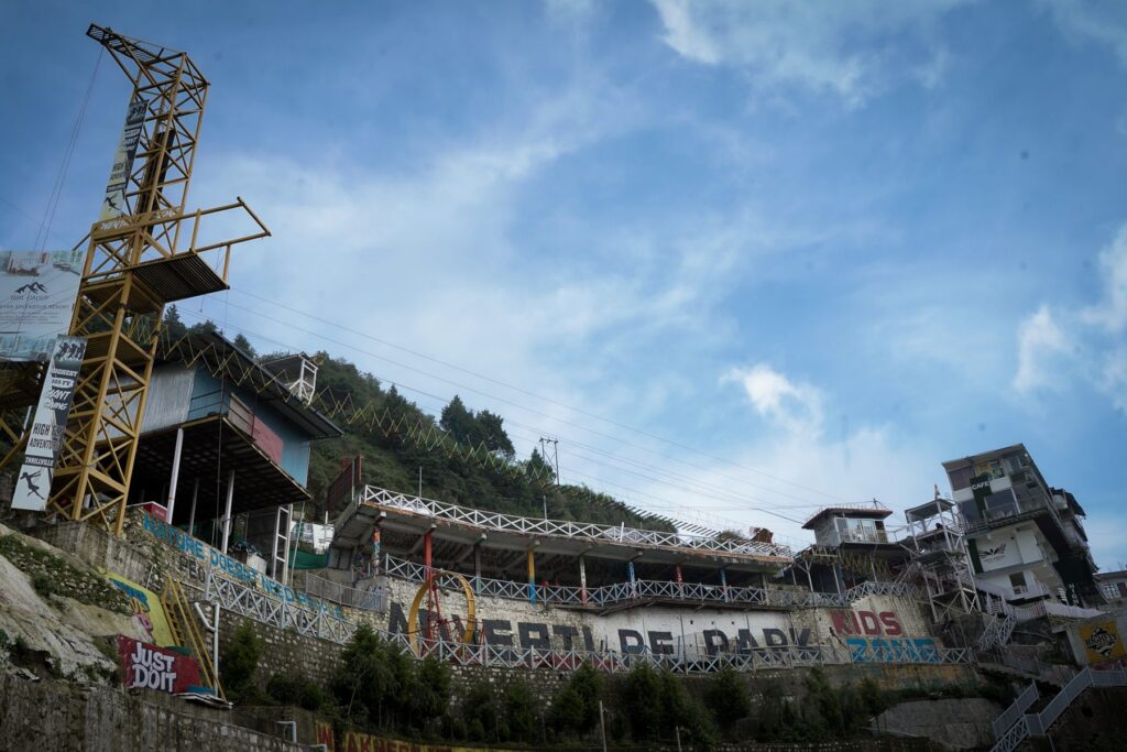 The High Fly Adventure park in Suwakholi on Dhanaulti Road near Mussoorie, with the swing tower under a blue sky